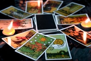 vecteezy_tarot-reading-with-tarot-card-background-and-candlelight-on_8726421